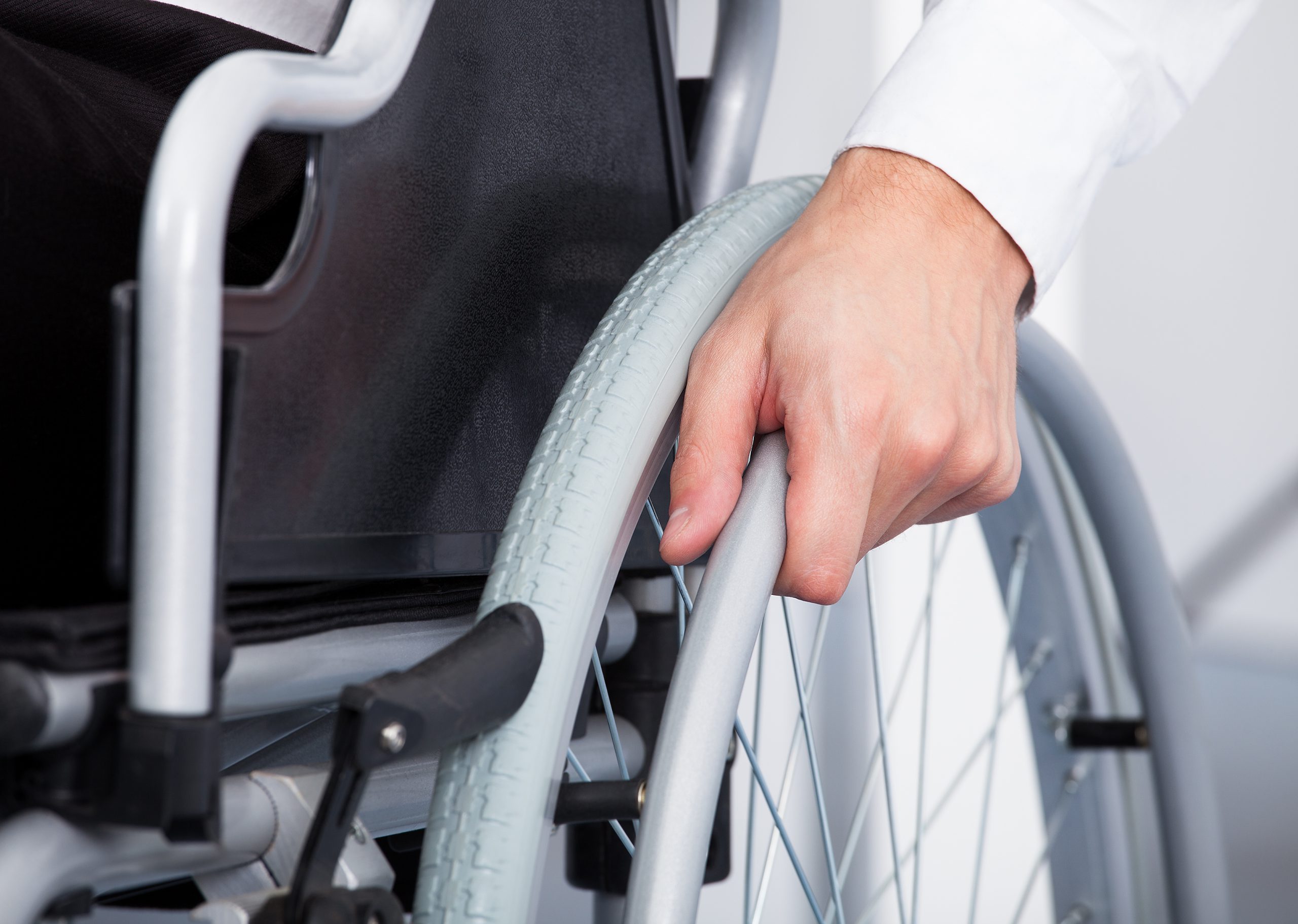 9799343-businessman-on-wheelchair